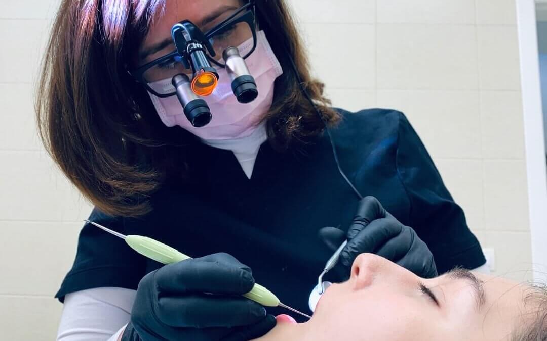 doctor checking a patients teeth